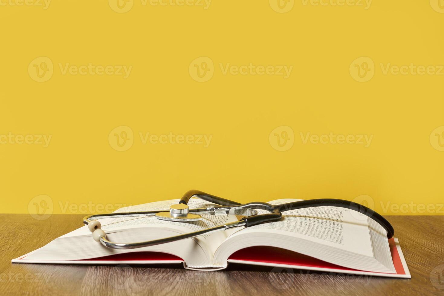 an open book with a stethoscope on top of it photo