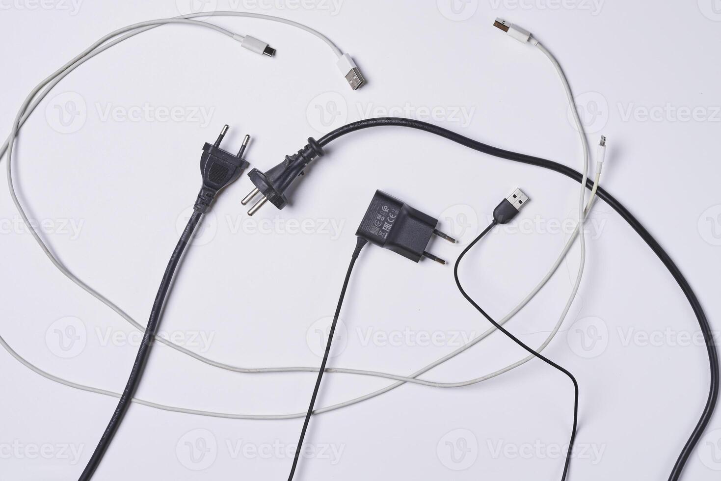 a group of cables connected to a power strip photo