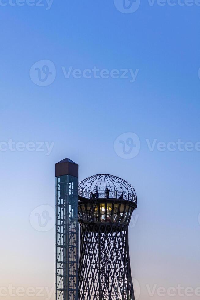 Lit up water tower photo