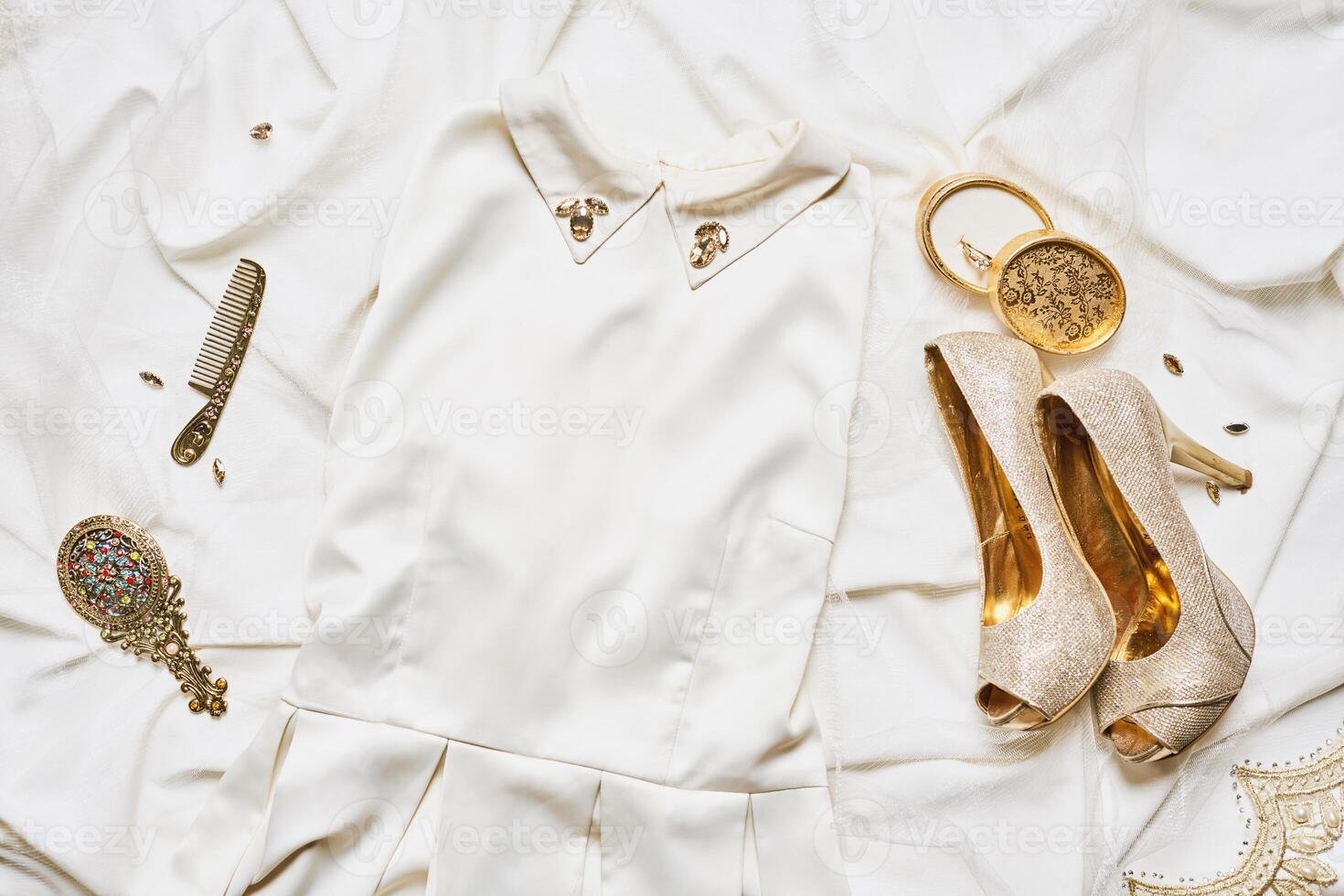 golden outfit on a silk satin photo