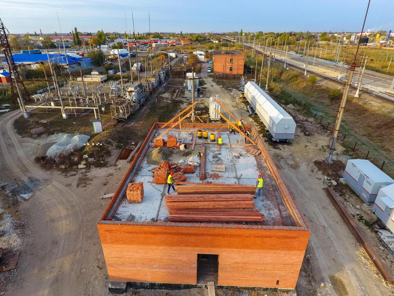Russia, Krasnodar 2021. Construction of a brick building. Installation of the roof. Construction works. photo