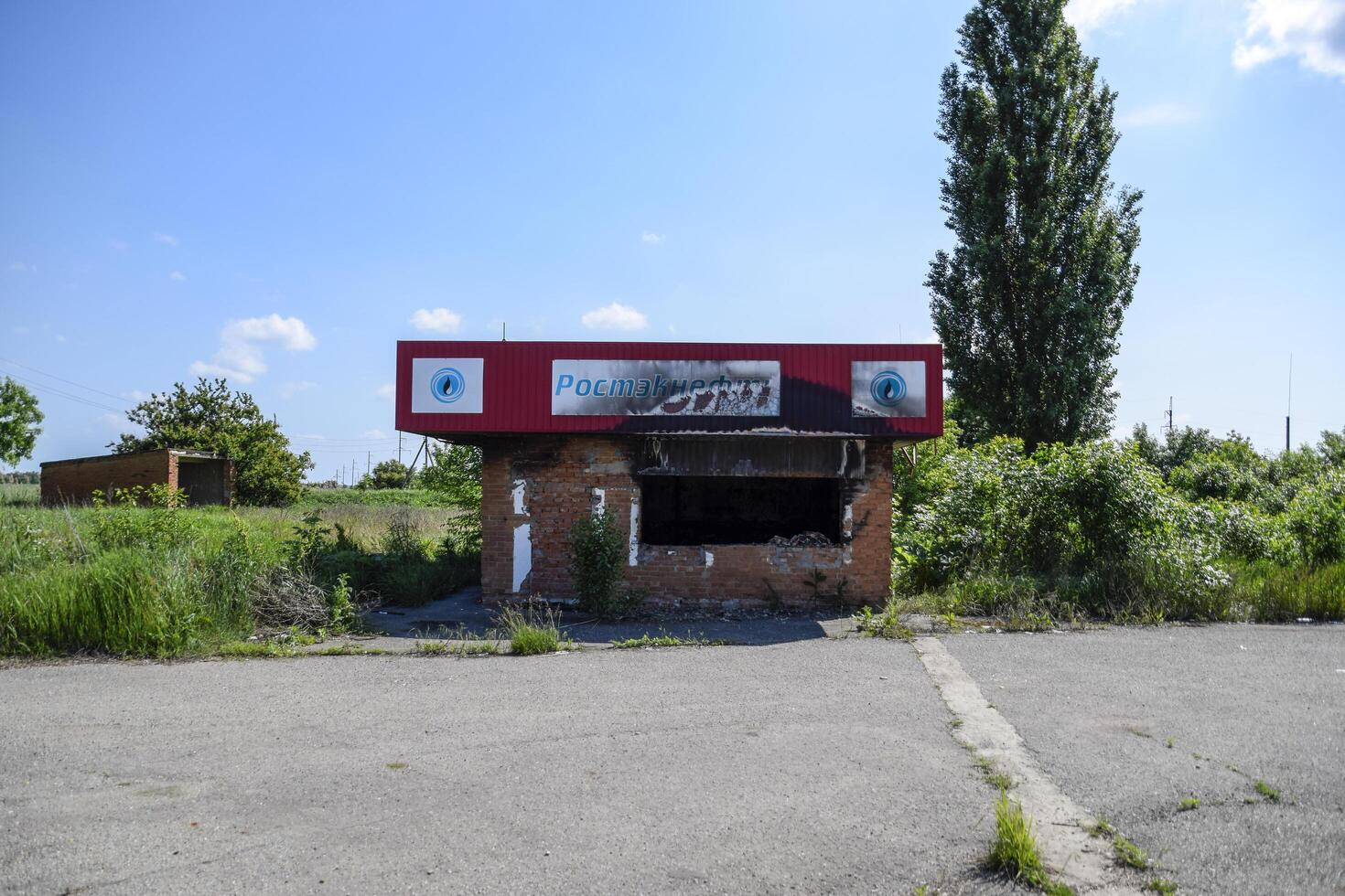 Russia, Novorossiysk 2021. Burned gas station. Ruins in the place of a burnt petrol station. photo