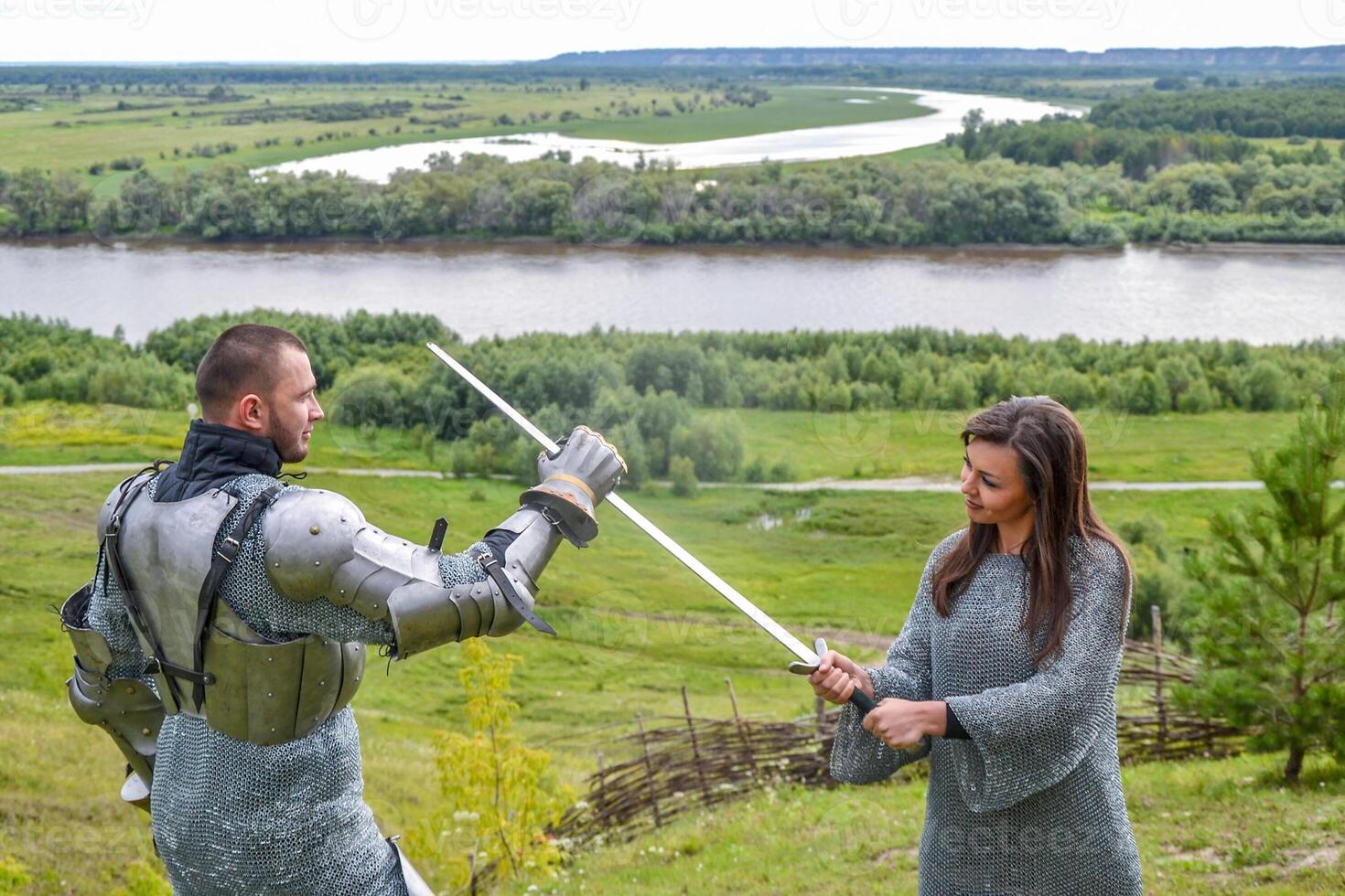 lady in chain mail and a knight in armor photo