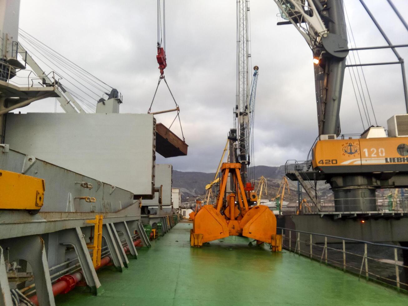 Russia, Novorossiysk 2021. Large buckets for port loaders. Dreglayner, Hydraulic and cable photo