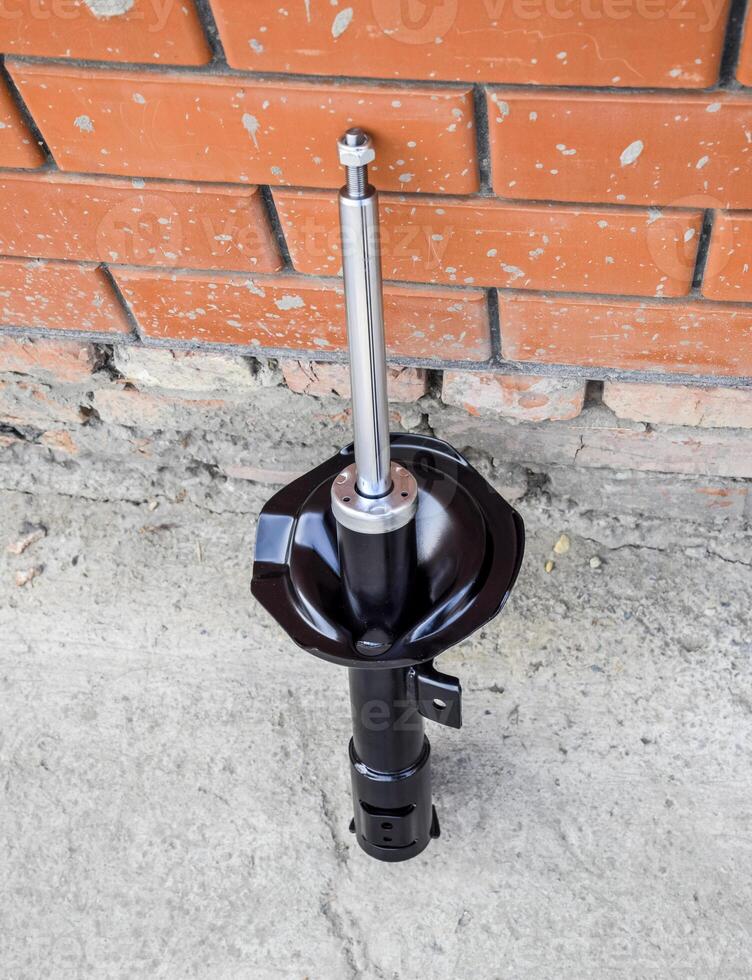 Car strut. Front shock absorber of a car photo