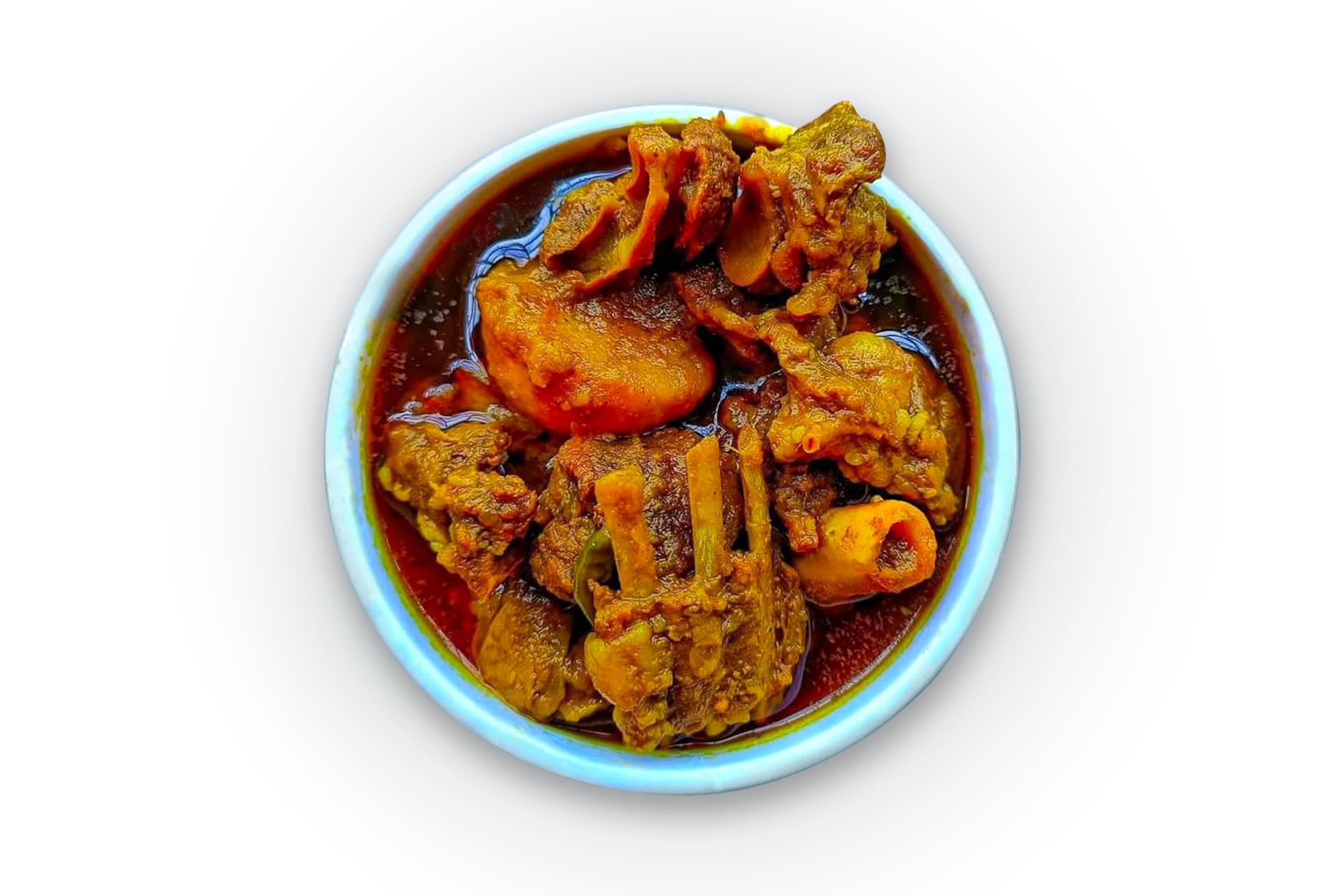 Mutton curry isolated on a white background, mutton kosha or masala in a white bowl, top view