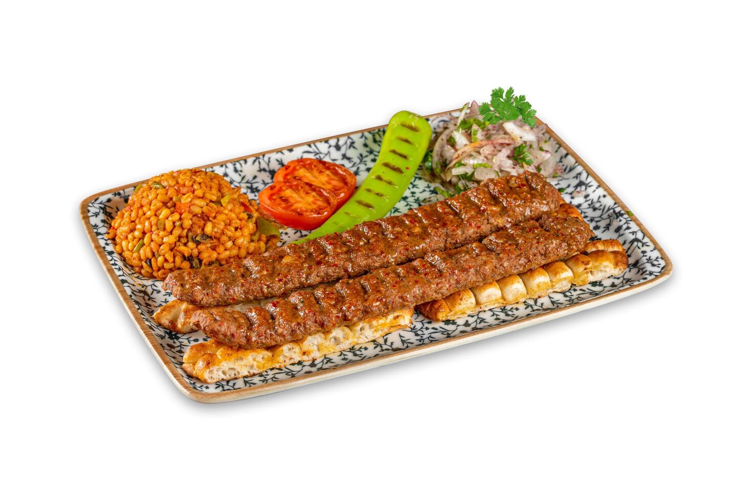Adana Kebab served with grilled vegetables onions, bulgur rice on a plate. Urfa kebab photo