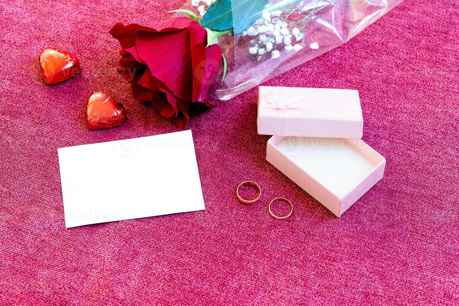 valentines day chocolates rose white card and rings photo
