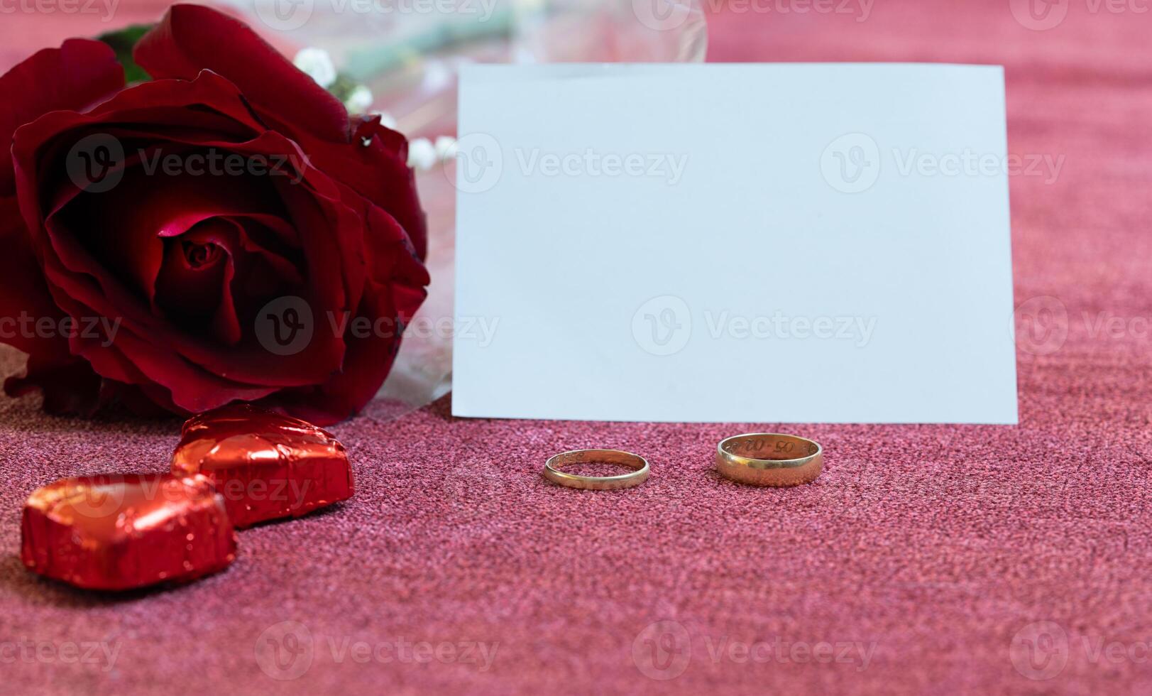 valentines day card rose golden rings and chocolates photo