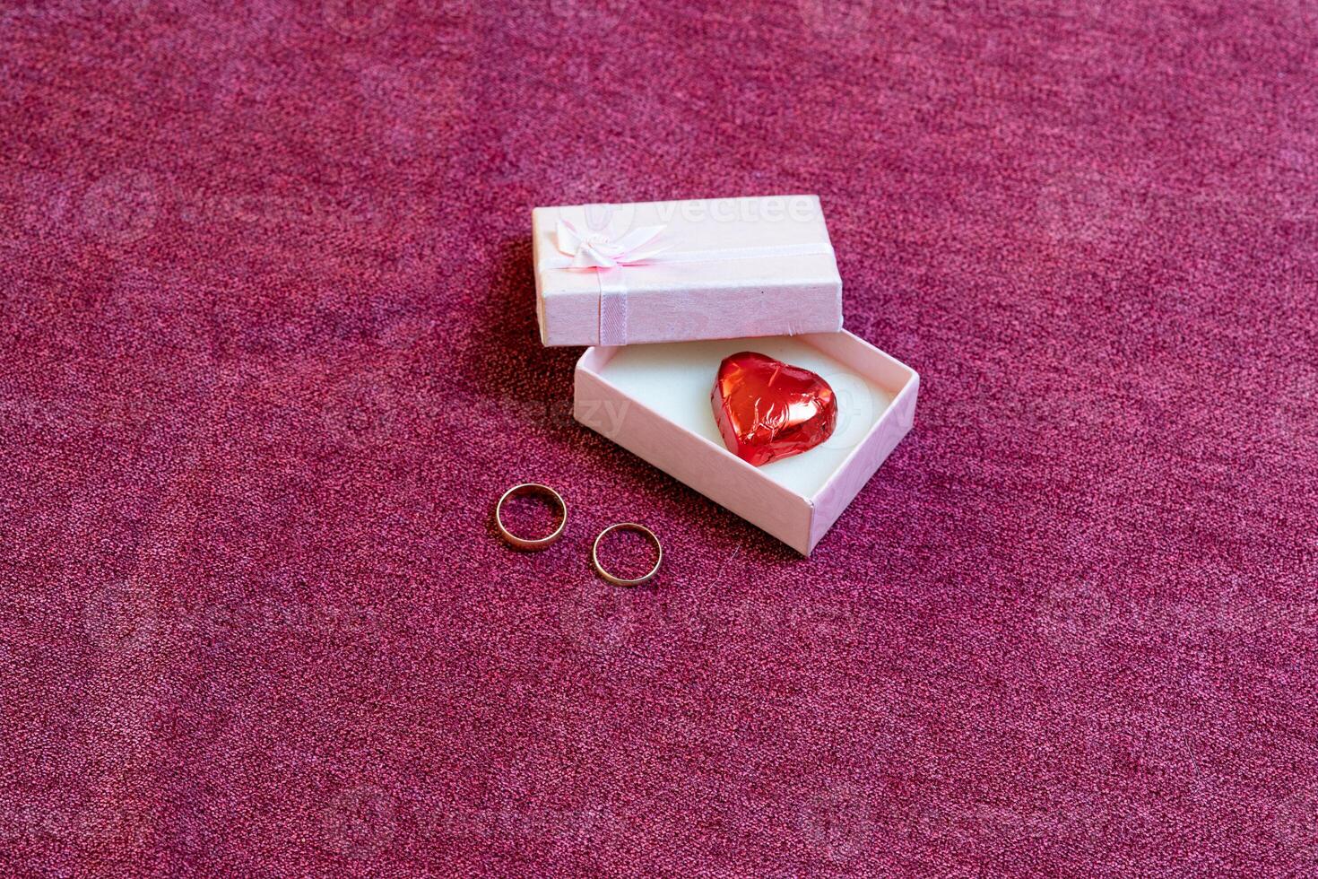 valentines day engagement rings and chocolate in a box photo