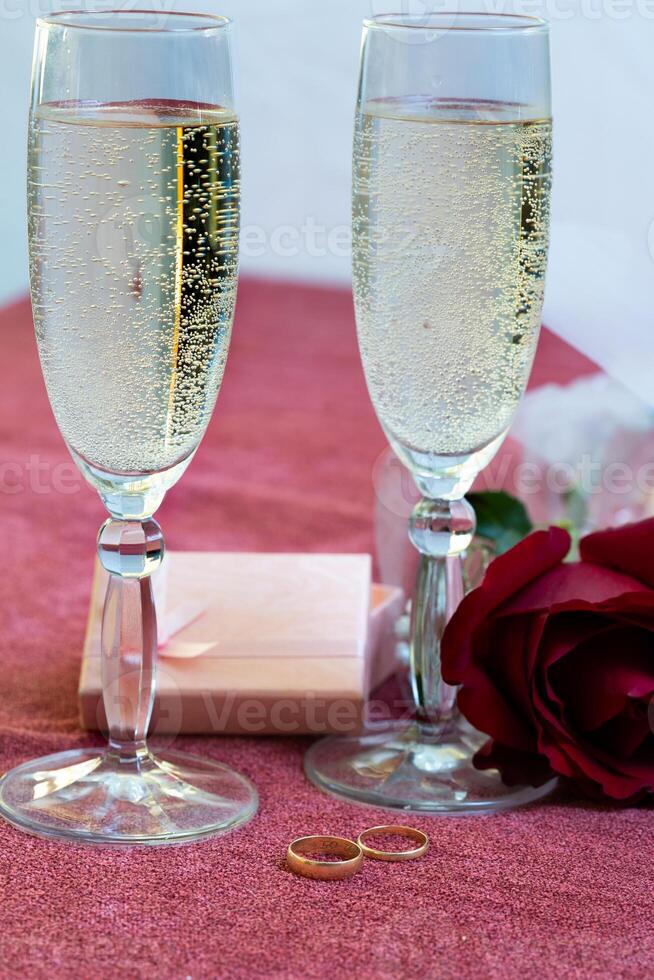 valentines day glasses of champagne and rings photo