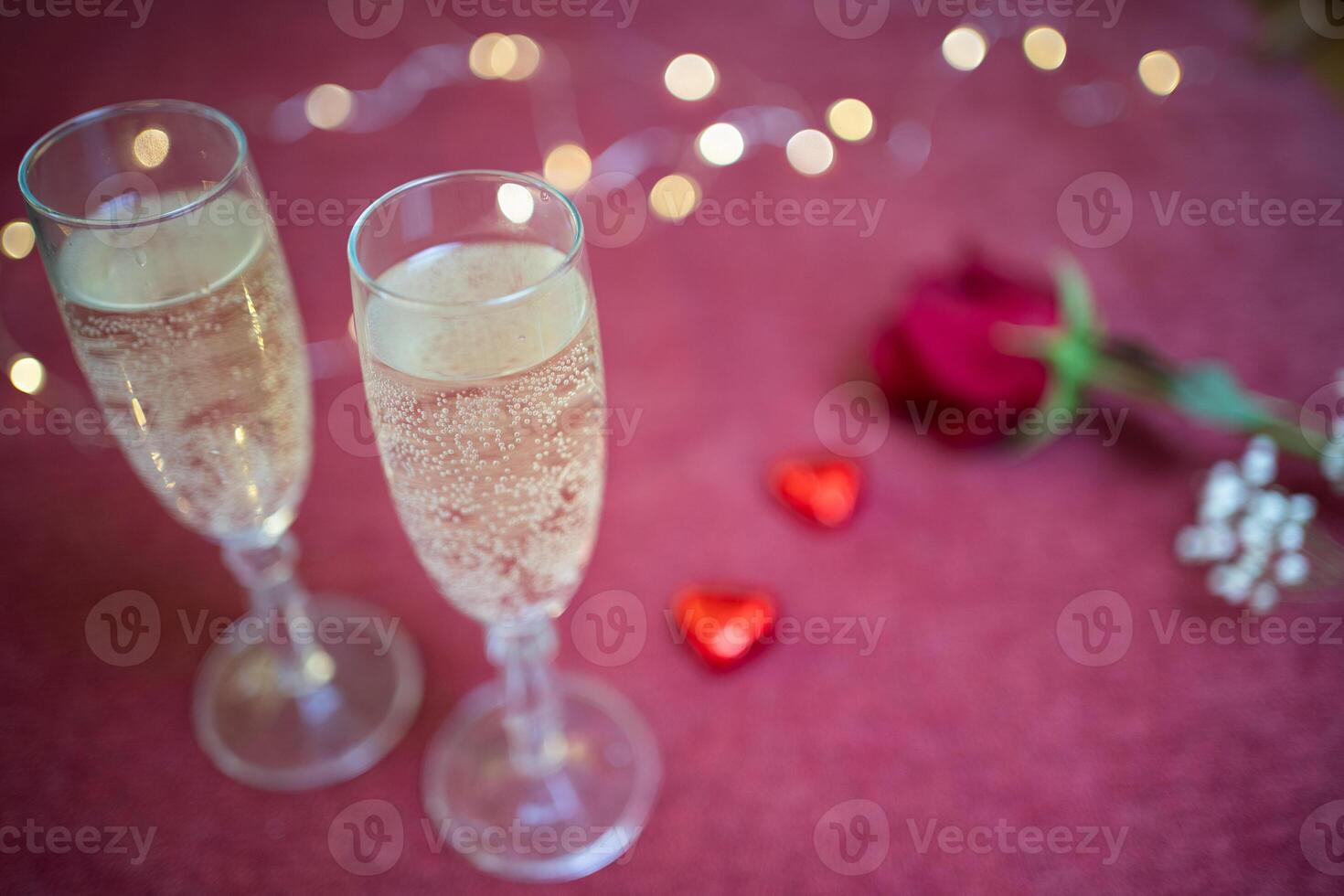 valentines day glasses of champagne close up and lights photo