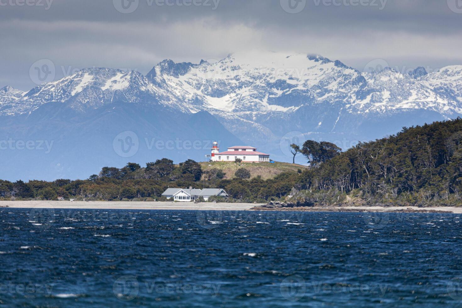 Abandoned lighthouse over the Pacific Ocean in Patagonia photo