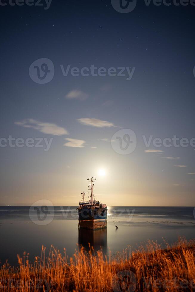 abandoned ship under a starry sky vertical photo