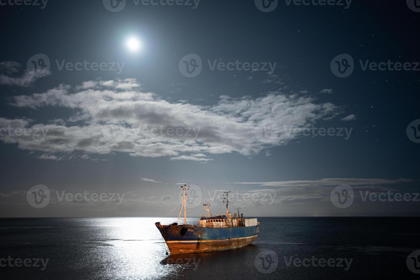 abandoned ship under a starry sky photo