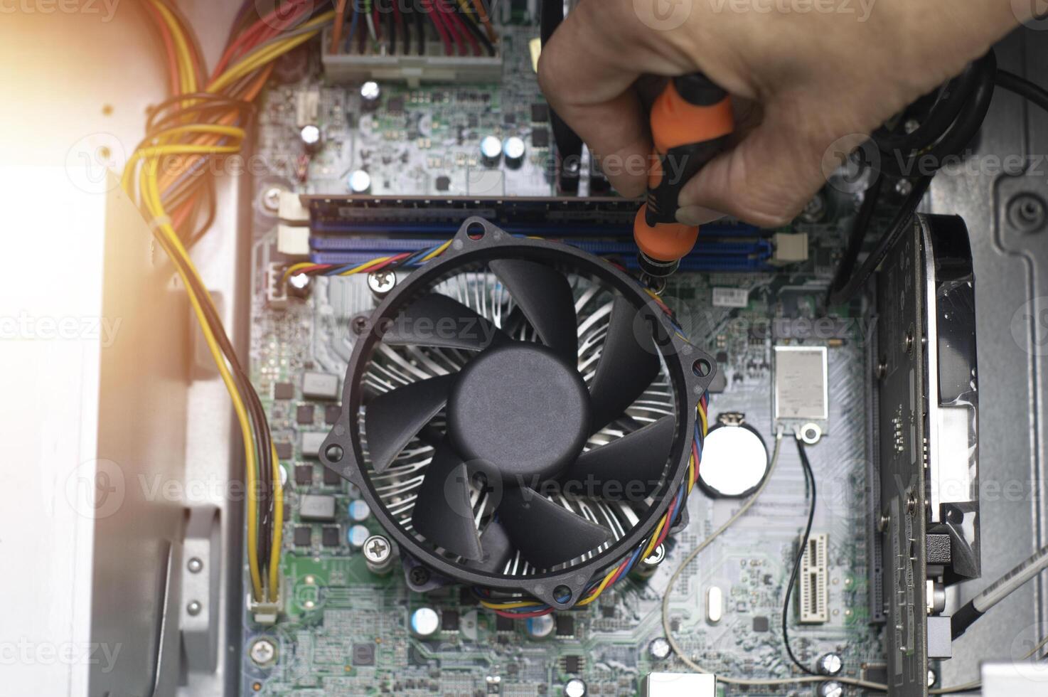 Technicians are repairing, assembling computer motherboards. photo