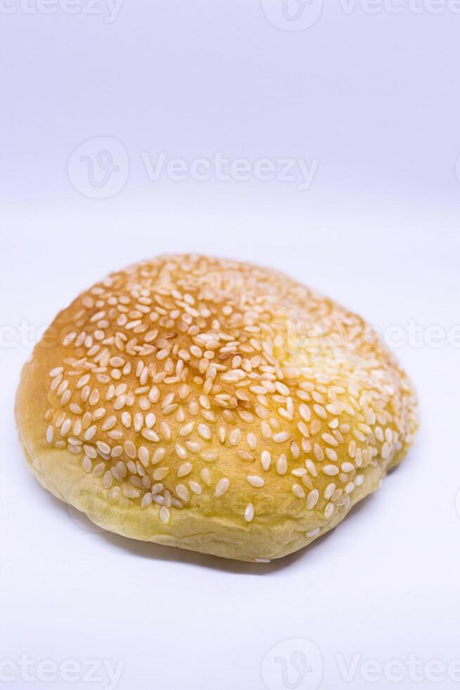 Sesame bun side view food photography close up on isolated white background photo