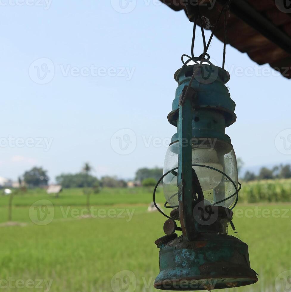 old style green lamps on a blue sky background photo