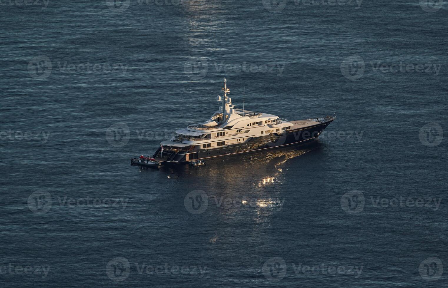 Monaco, lonely mega yacht in sea at sunset, huge motor boat, wealth life of billionaires photo