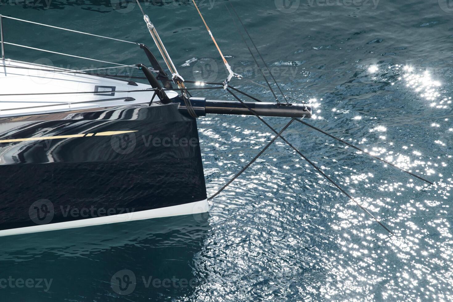 Sun glare on glossy board boats, azure water, tranquillity in port Hercules, bows of moored sailing boats at sunny day, megayachts, Monaco, Monte-Carlo photo