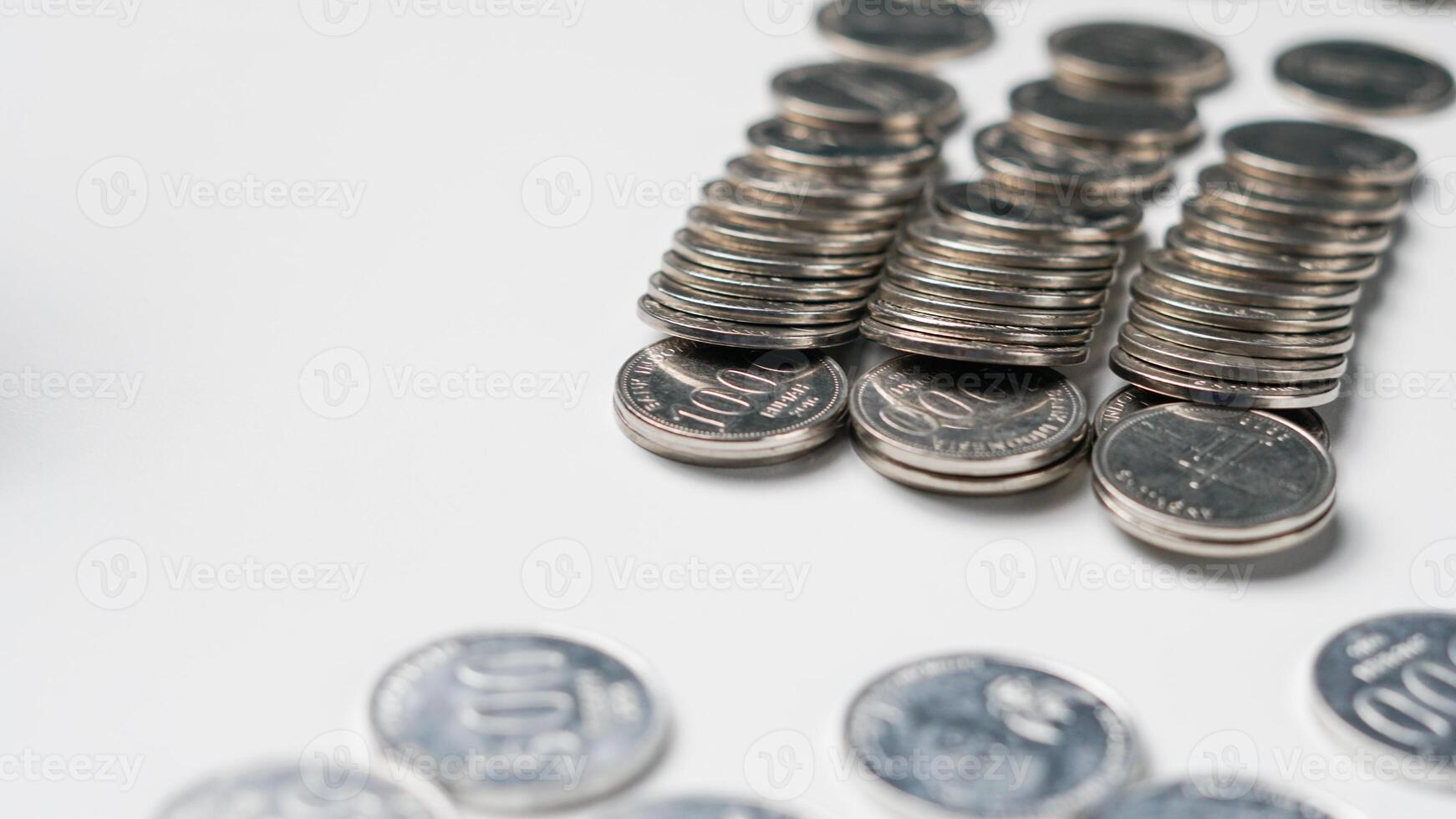 collection of Indonesian rupiah coins on a white background photo