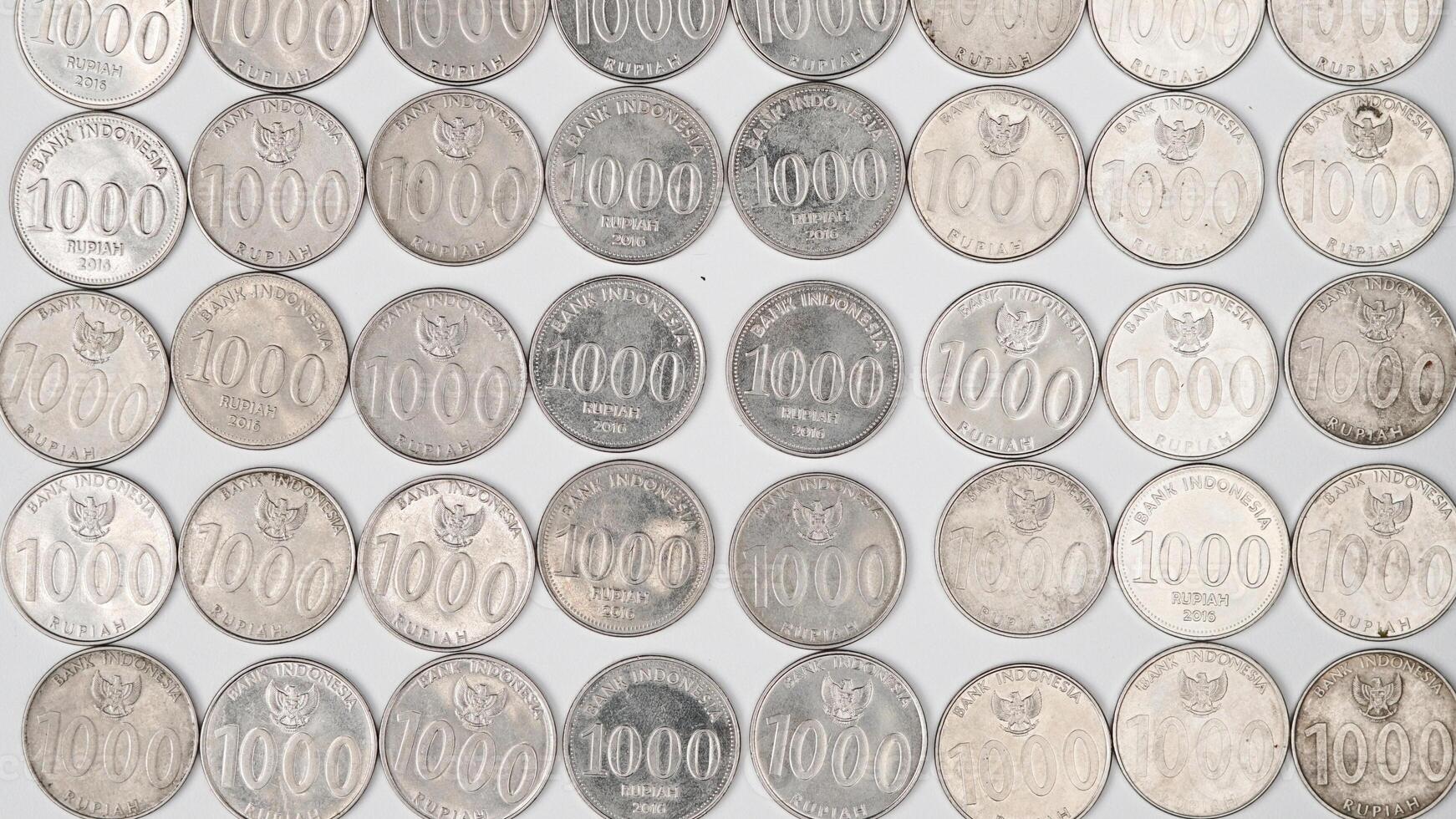 collection of 1000 rupiah coins, Indonesian currency photo