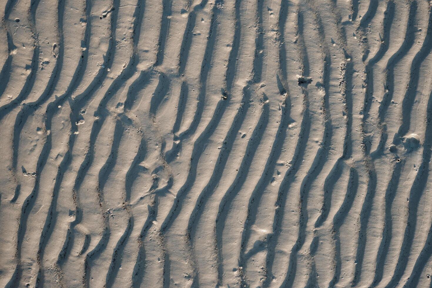 Line pattern on sand created by waves in Belitung Island beach, Indonesia. Belitung is one of the most popular tourist destinations in Indonesia. photo