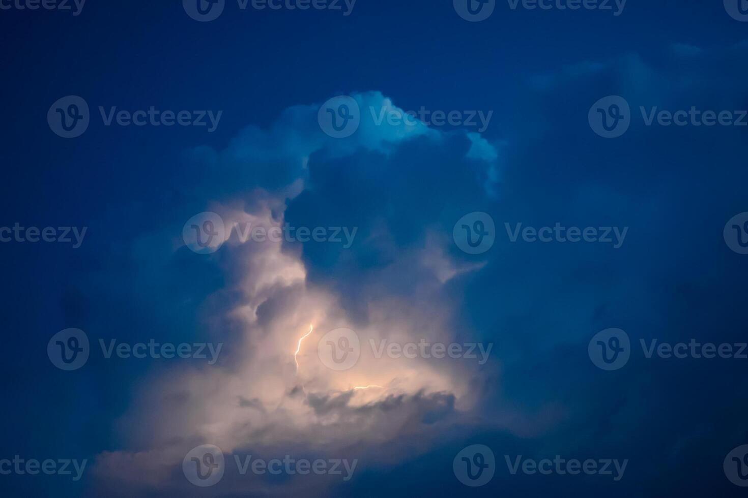 Lightnings in storm clouds. Peals of a thunder and the sparkling lightnings in clouds photo
