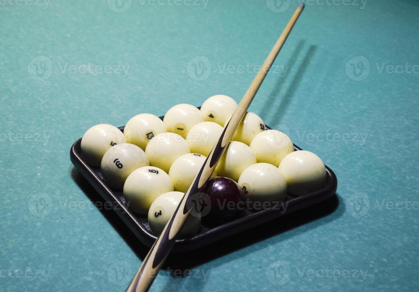 Billiards, billiard table, balls and cue. Balls in the tray and photo