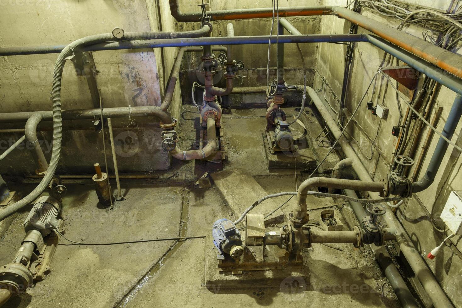 Basement of a water pumping station. Abandoned post-apocalyptic photo