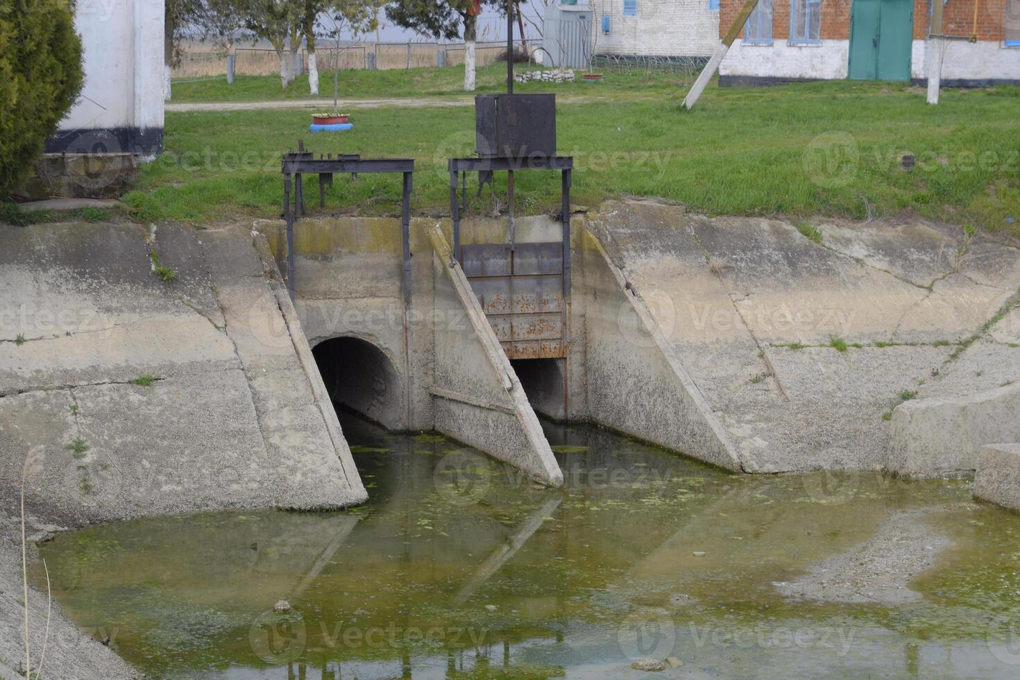 Gateway of a water pumping station. The message of two reservoirs. Hydraulic construction. photo