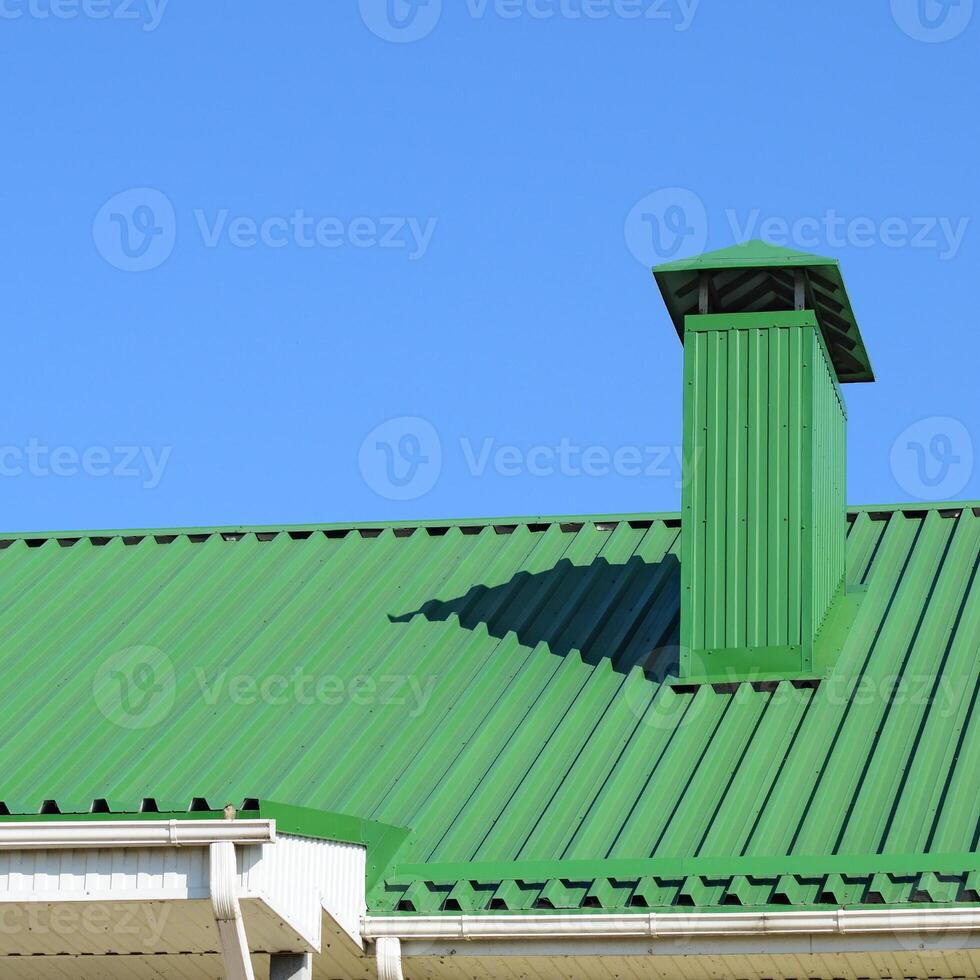 Hood on the roof of metal sheets photo