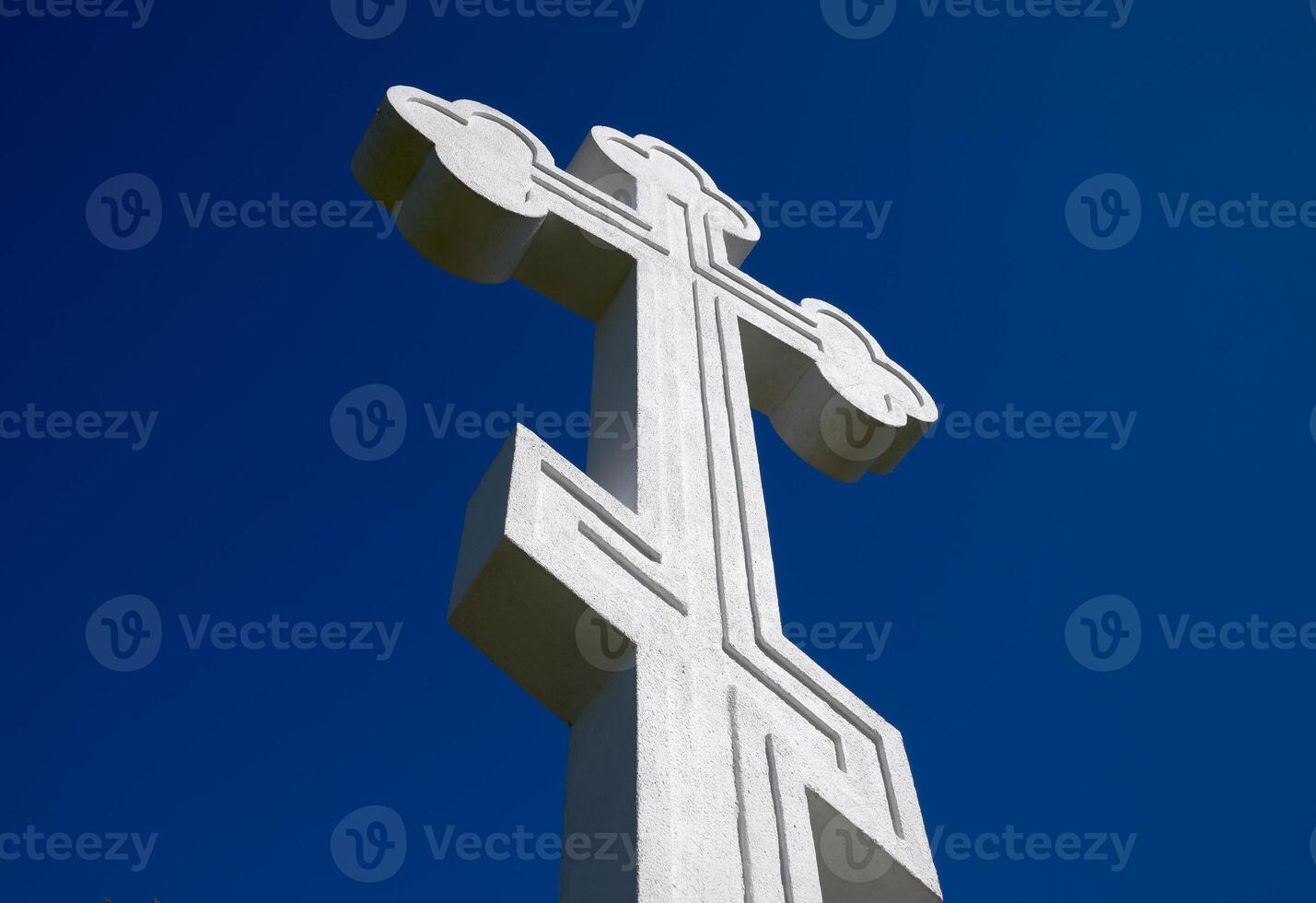 White orthodox christian cross on blue sky background. photo