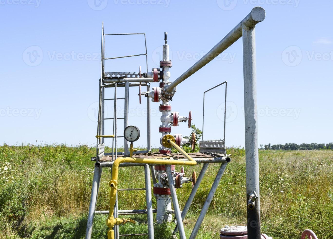 Well for oil and gas production. Oil well wellhead equipment. Oil production photo