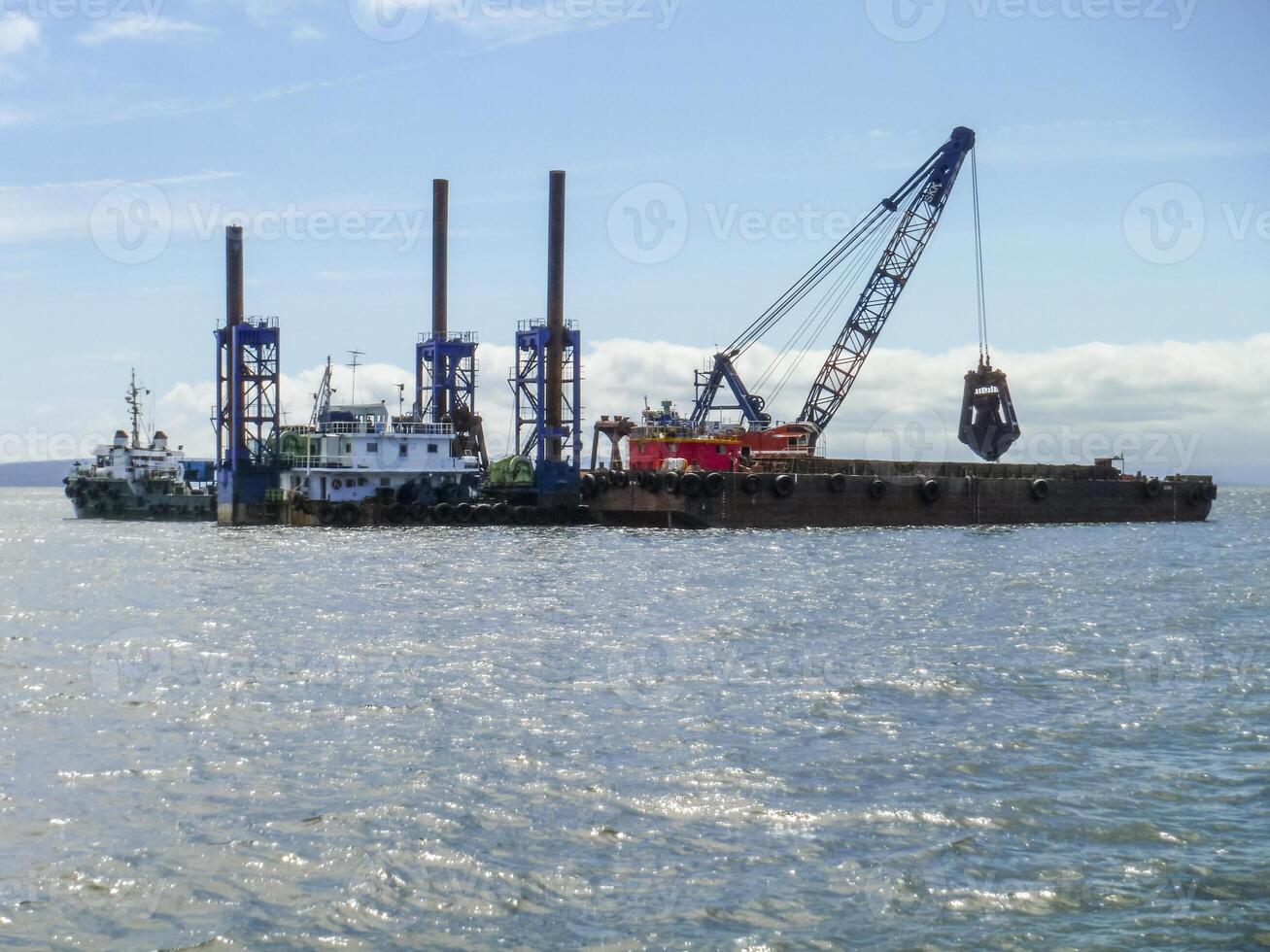 The cargo ship with the crane, the top view. Pipelaying barge. photo