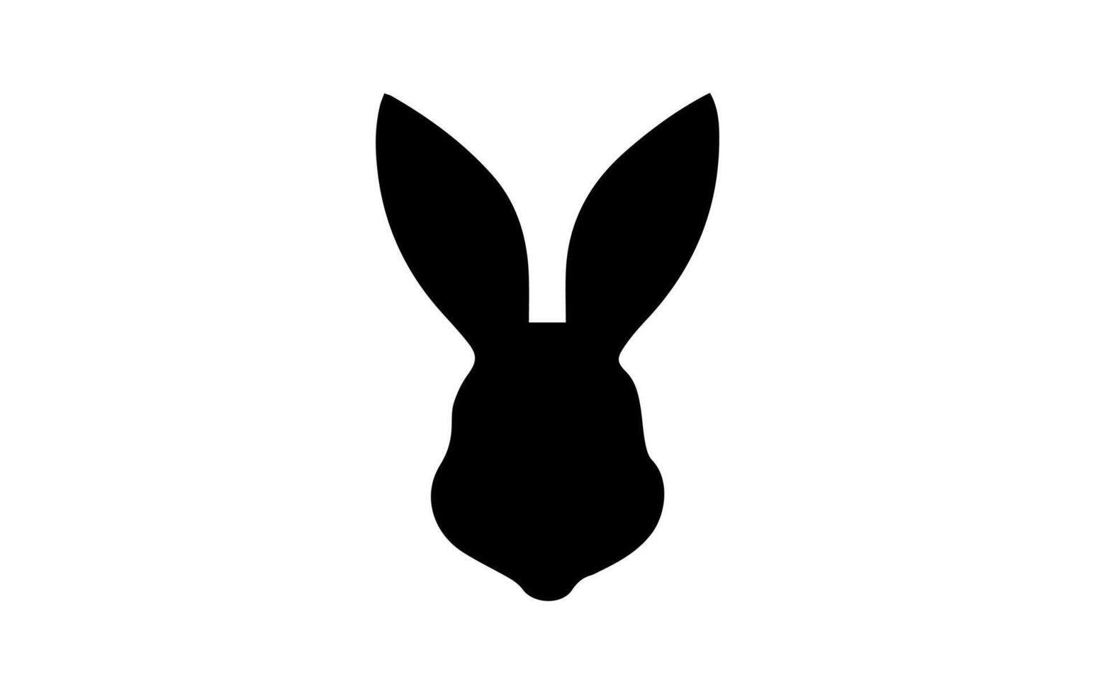 Silhouette of a rabbit head. Easter Bunny. Isolated on white background. A simple black icon of hare. Cute animal. Ideal for logo, emblem, pictogram, print, design element for greeting card, vector
