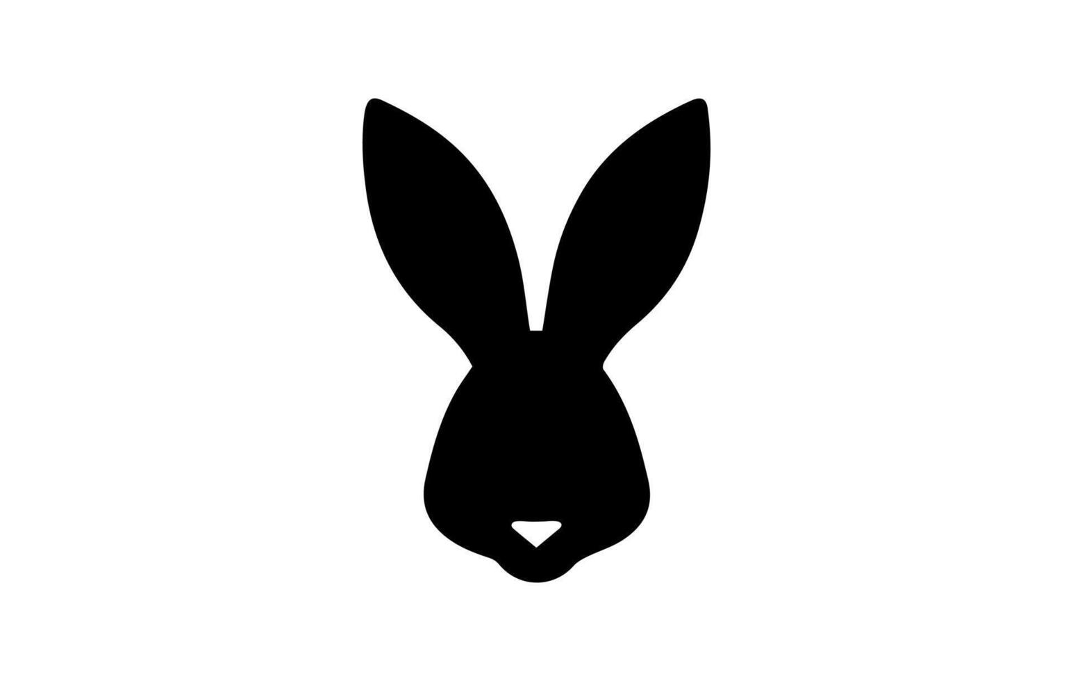 Silhouette of a rabbit head. Easter Bunny. Isolated on white background. A simple black icon of hare. Cute animal. Ideal for logo, emblem, pictogram, print, design element for greeting card, vector