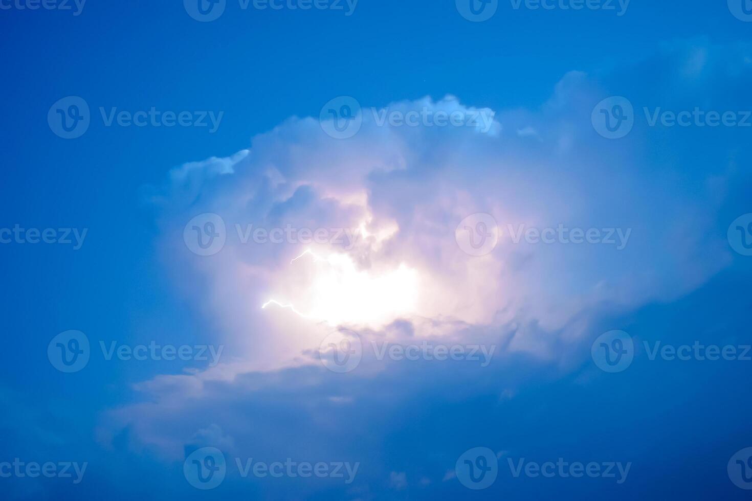 Lightnings in storm clouds. Peals of a thunder and the sparkling lightnings in clouds photo