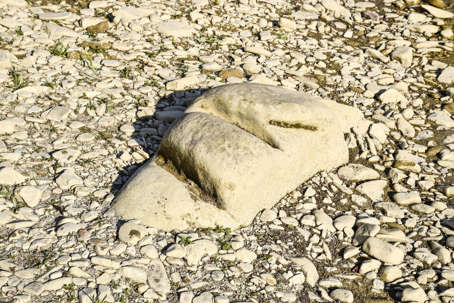 Stone cut by the current. The cut stone. photo