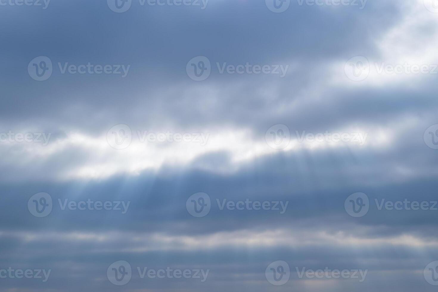 Sunlight filtering through the clouds photo