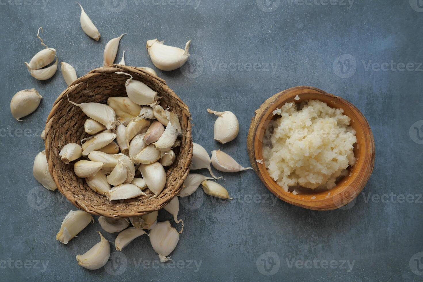 top view of minced garlic on a wooden spoon photo