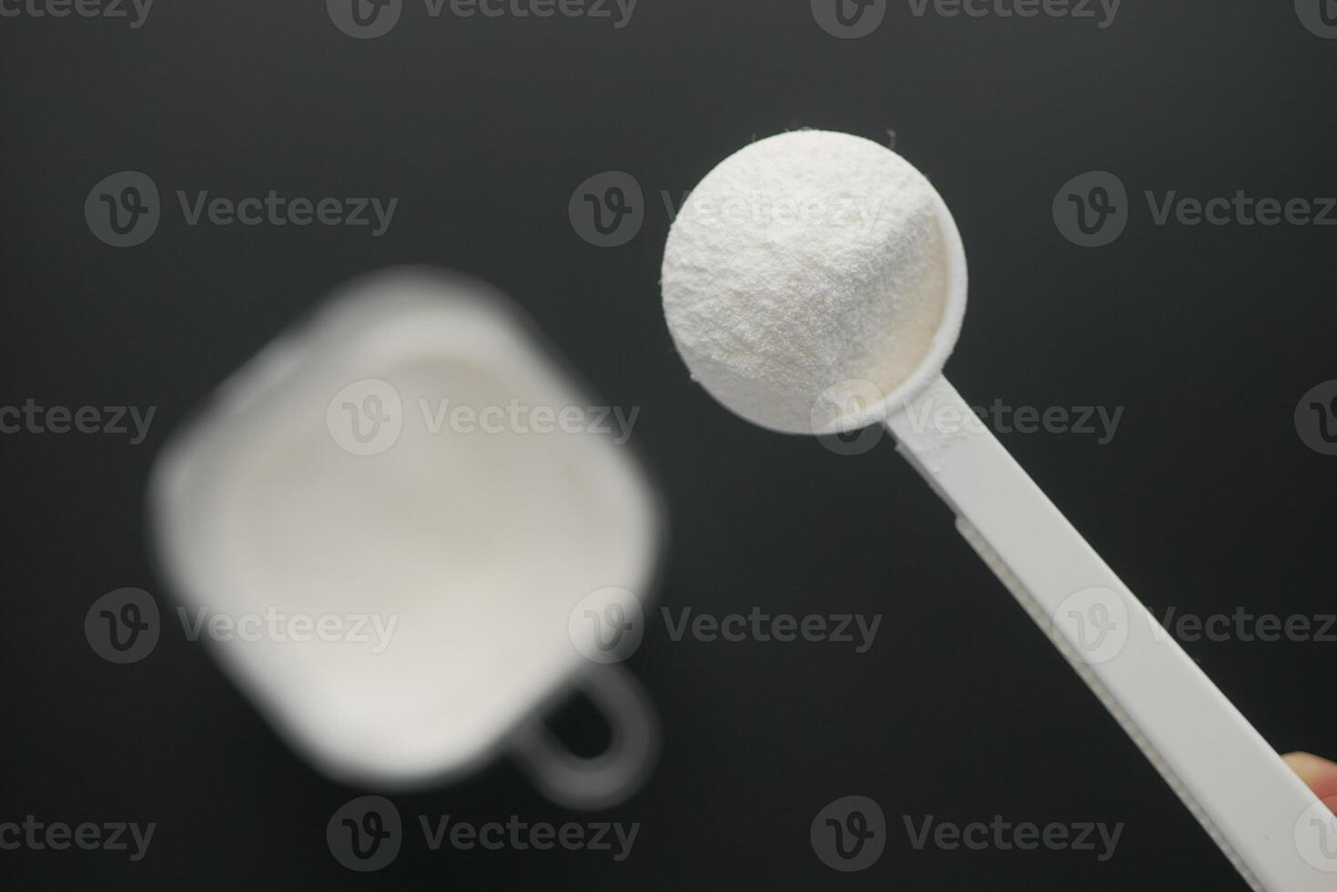 baby milk powder in a plastic spoon photo