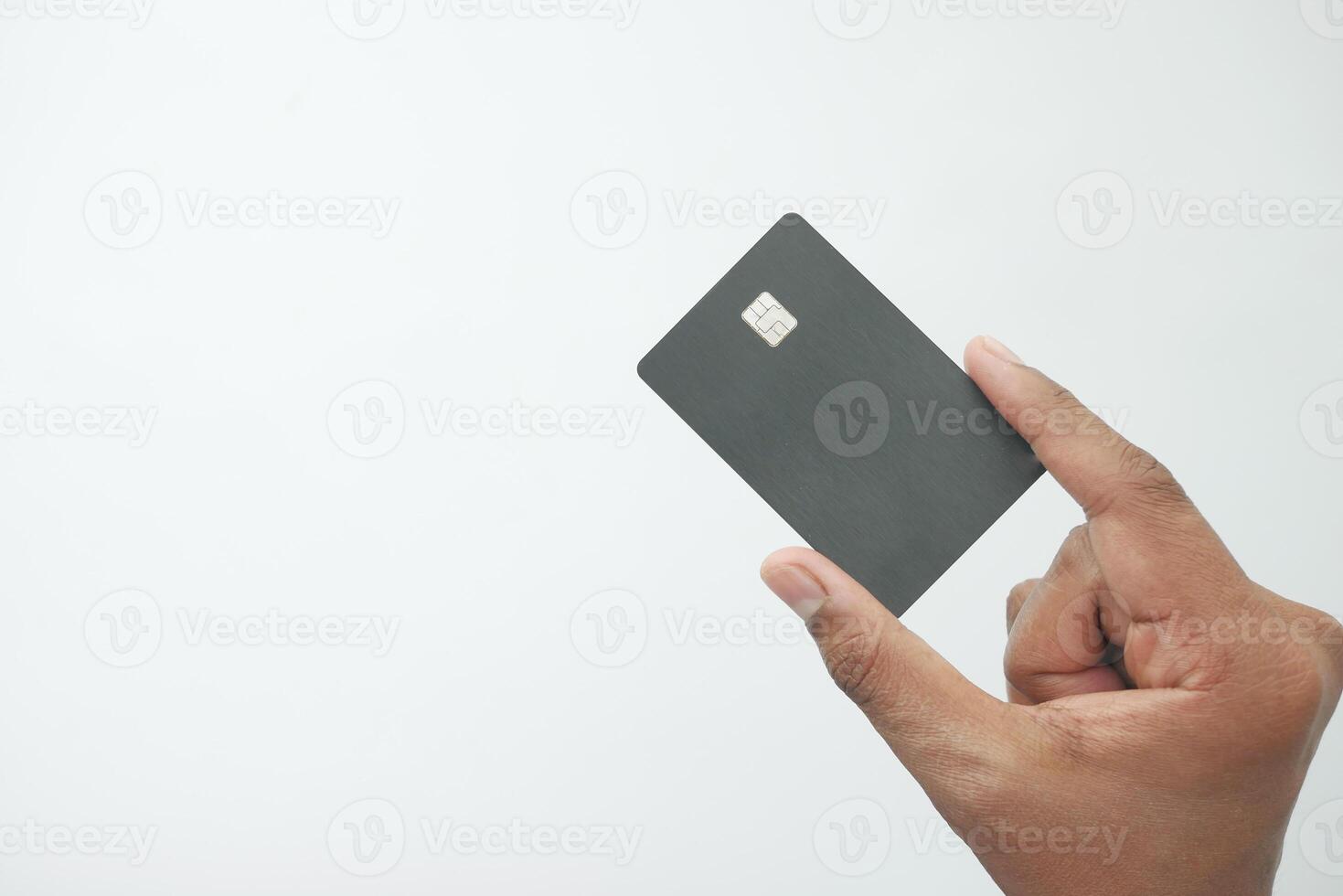 close up of person hand holding credit card photo