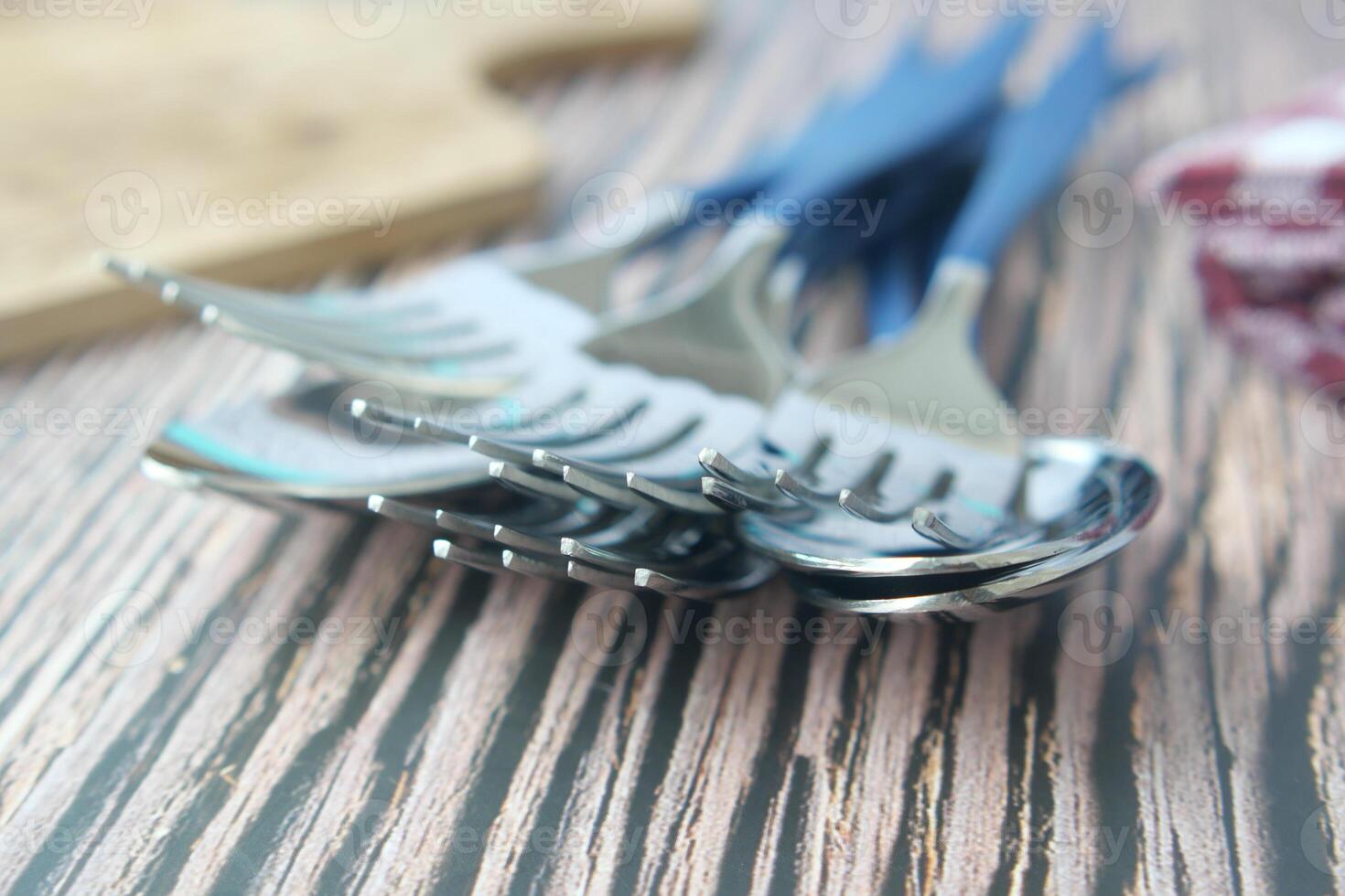 sliver spoon fork and table cloth on table photo