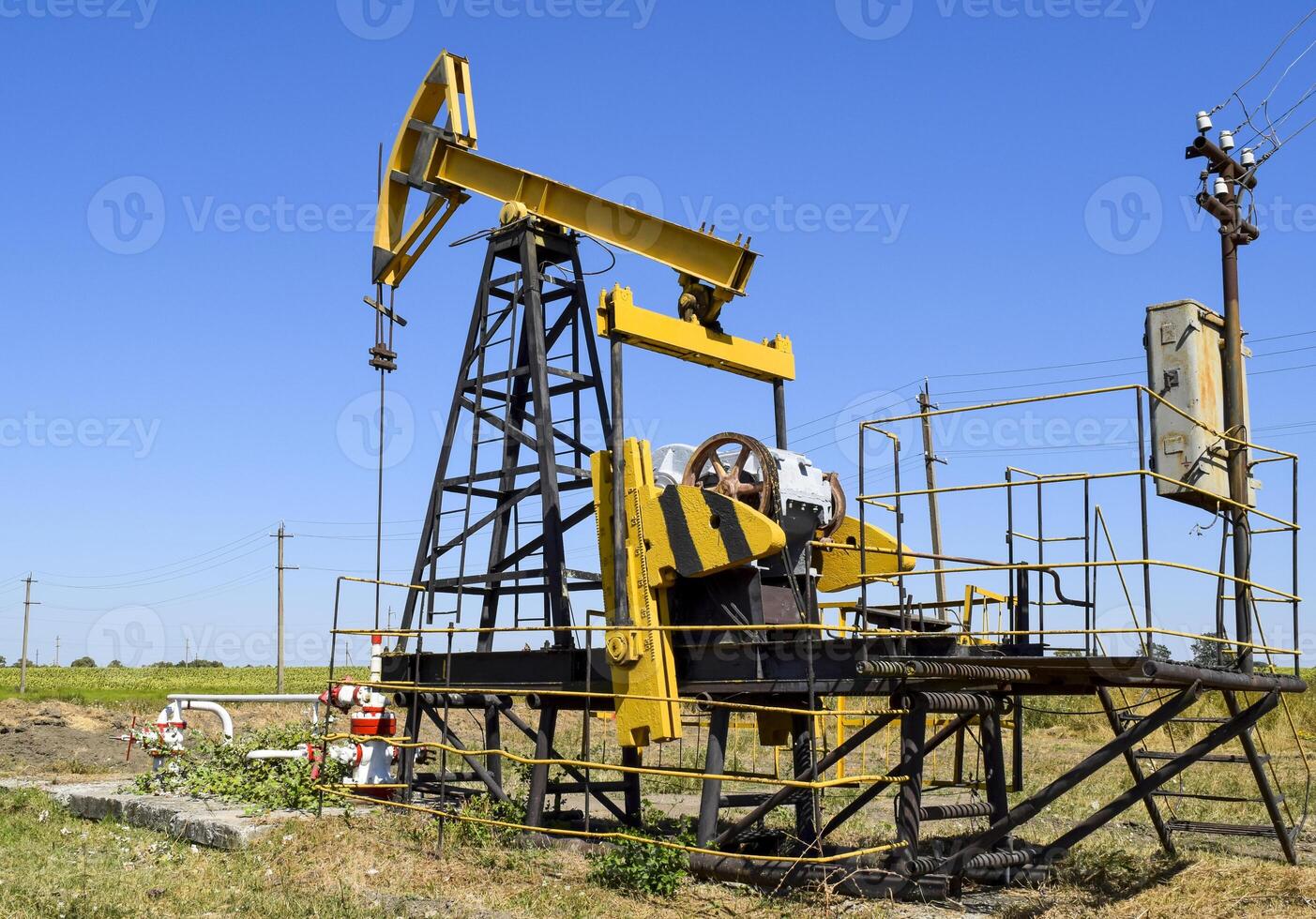 Pumping unit as the oil pump installed on a well photo