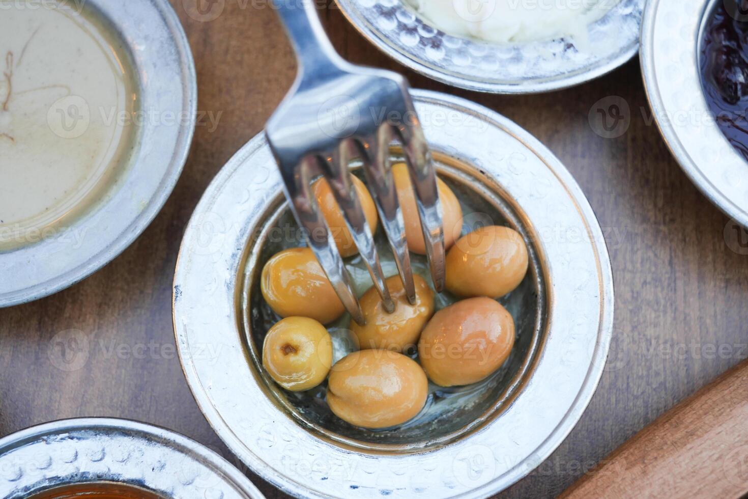 top view of green olive on a breakfast table photo