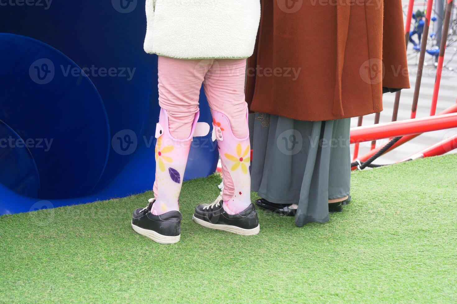 Child cerebral palsy disability, legs orthosis. photo