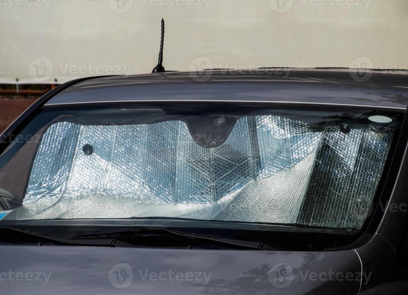 Sun Reflector windscreen. Protection of the car panel from direct sunlight. photo