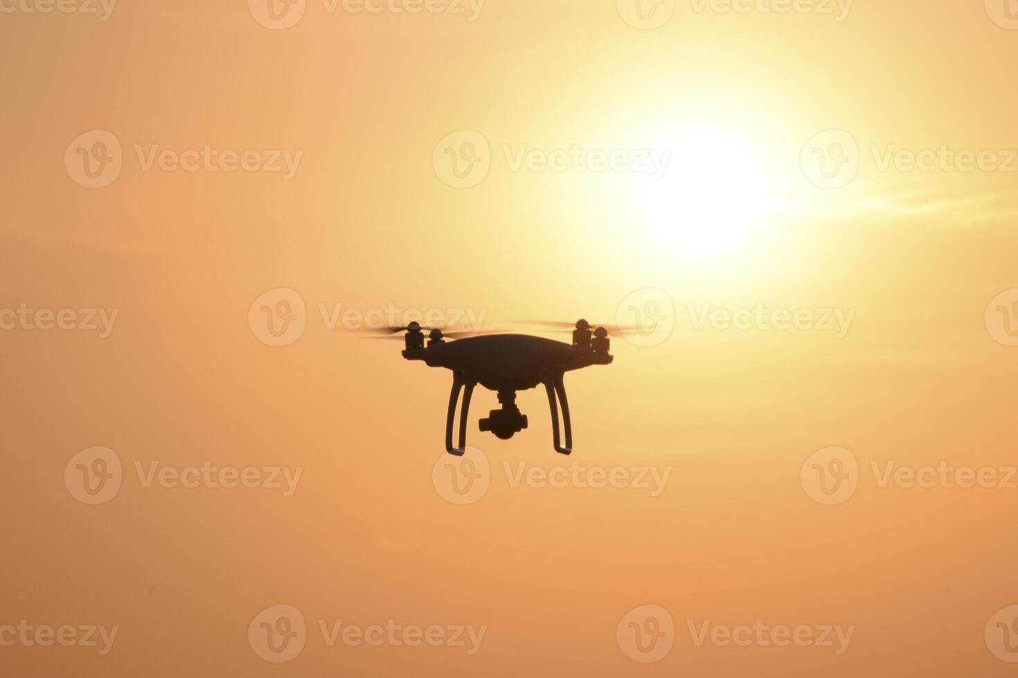 drone silhouette against the background of the sunset photo