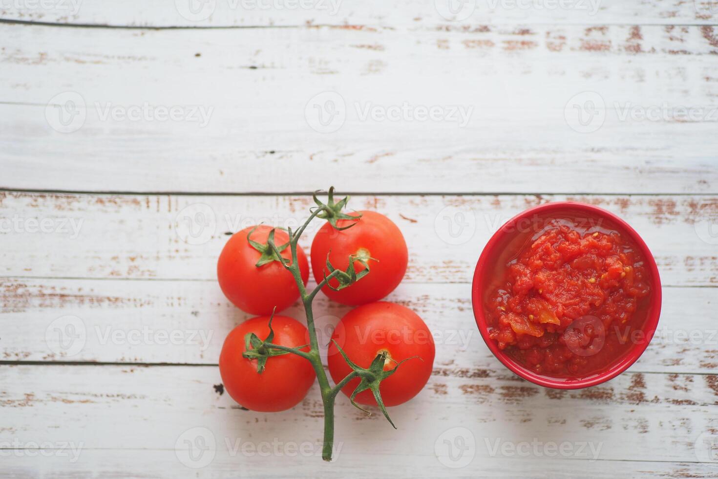 Tomato paste with ripe tomatoes. photo